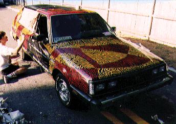 [PICTURE OF A VIVIDLY PAINTED CAR]
